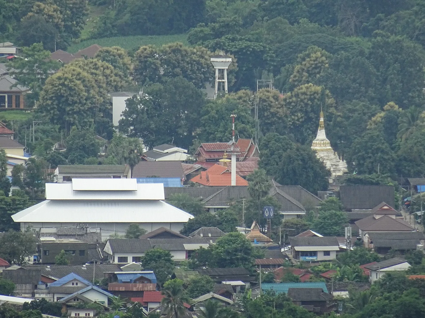 Buildings and green hills in Pai